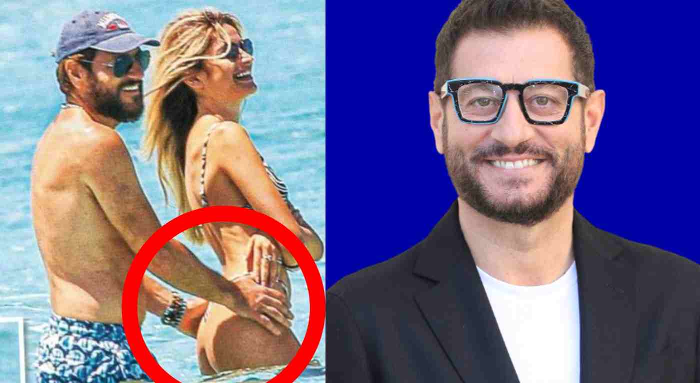 Enrico Papi e le mosse hot in spiaggia con una donna, ma non è sua moglie